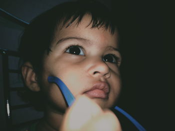 Close-up of thoughtful cute boy looking away