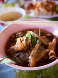 Close-up of chicken legs in bowl