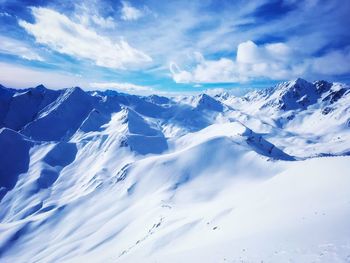 Scenic view of snowcapped mountains against sky