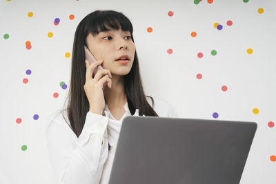 Portrait of woman using mobile phone