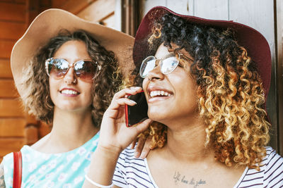 Young woman talking on mobile phone fashion