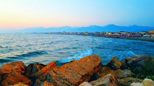 Scenic view of sea against sky during sunset