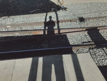 High angle view of person standing on railroad track