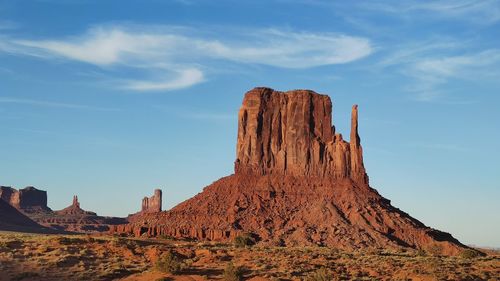 Low angle view of rock formations against sky