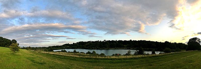 Scenic view of lake against sky during sunset