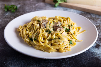 Italian fettuccine pasta with porcini mushrooms. italian pasta. vegetarian dish.