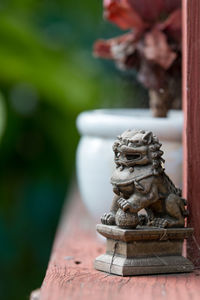 Close-up of statue against blurred background