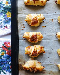 Directly above shot of desserts arranged in row on tray