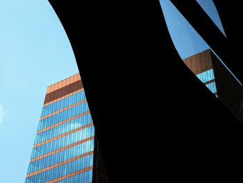 Low angle view of modern buildings against clear sky