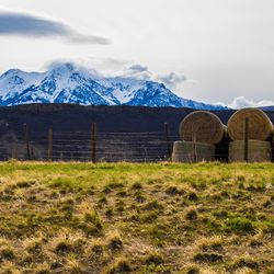 Scenic view of snowcapped mountains against sky