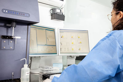 Scientist performing a flow cytometric analysis in the laboratory. flow cytometer.