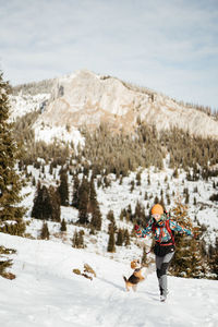 Man skiing on snow covered field