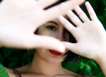 Close-up portrait of woman gesturing