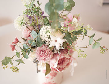 Close-up of pink flowering plant on table