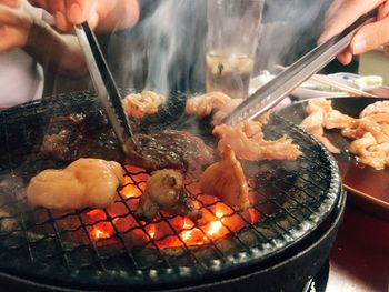 Close-up of meat on barbecue grill