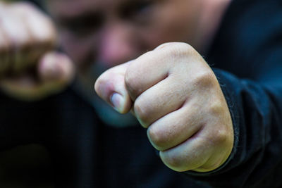 Close-up of man holding hands