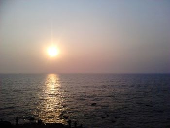 Scenic view of sea at sunset