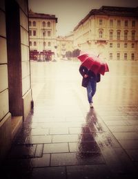 Full length of woman walking in city