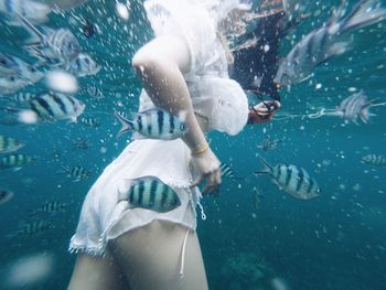 Woman swimming in sea