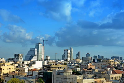 Buildings in city against sky