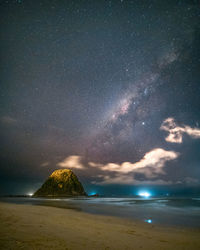 Scenic view of sea against sky at night