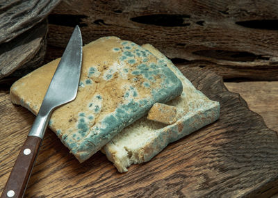 High angle view of bread on cutting board