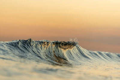Scenic view of desert against sky during sunset