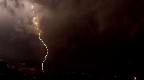 Low angle view of lightning over the sky