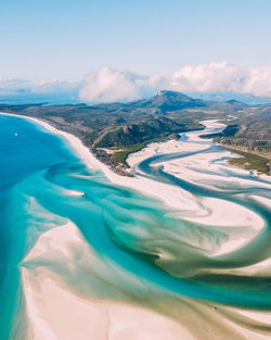 Aerial view of swimming pool by sea against sky