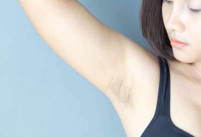 Close-up of woman against white background