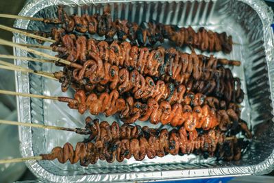 High angle view of meat on barbecue grill