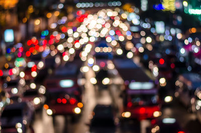 Defocused image of illuminated city at night