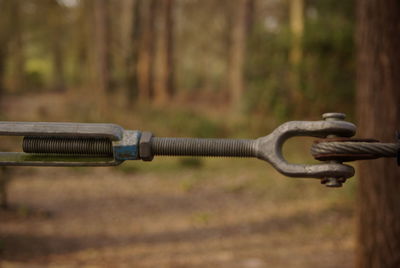 Close-up of metal chain on field