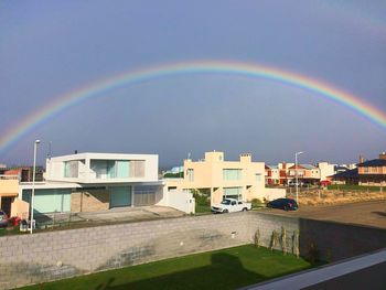 Rainbow over built structure