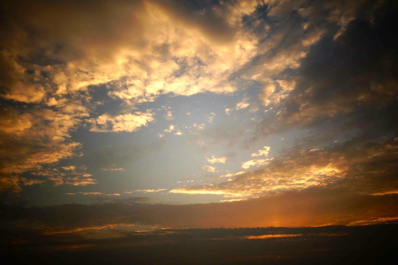 sunset, sky, scenics, tranquil scene, beauty in nature, tranquility, cloud - sky, nature, idyllic, dramatic sky, cloudscape, orange color, cloudy, silhouette, majestic, cloud, low angle view, sky only, atmospheric mood, weather