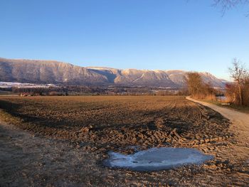 Scenic view of landscape against clear blue sky