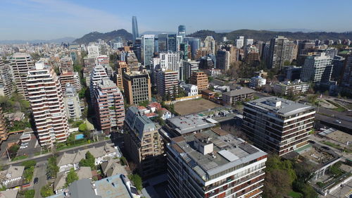 High angle view of buildings in city against sky