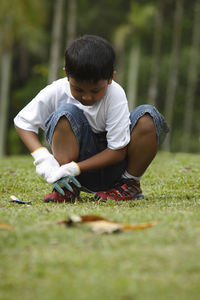 Rear view of boy on field