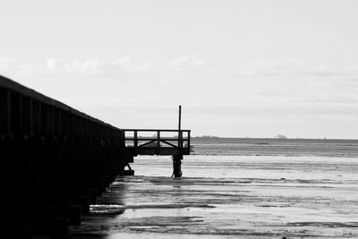 Pier over sea against sky