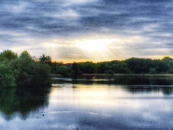 Scenic view of lake against sky during sunset