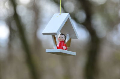 Close-up of child hanging on outdoors