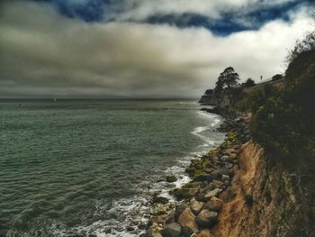 Scenic view of sea against cloudy sky