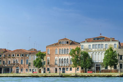 Buildings against blue sky