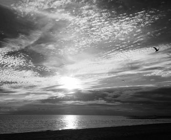 Scenic view of sea against sky at sunset