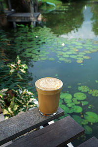 Latte coffee with natural landscape view of river side
