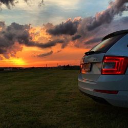 Scenic view of landscape against cloudy sky