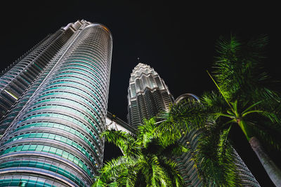 Low angle view of modern building against sky at night