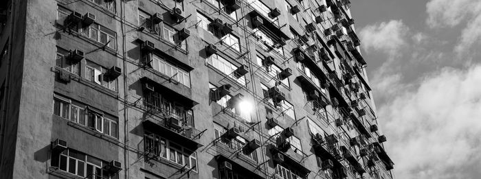 Low angle view of apartment building against sky