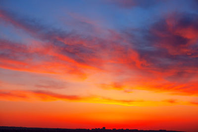 Low angle view of dramatic sky during sunset