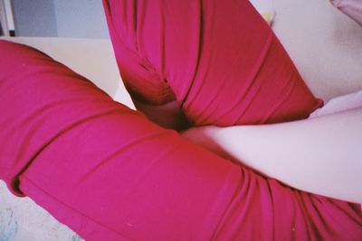 High angle view of woman relaxing on bed